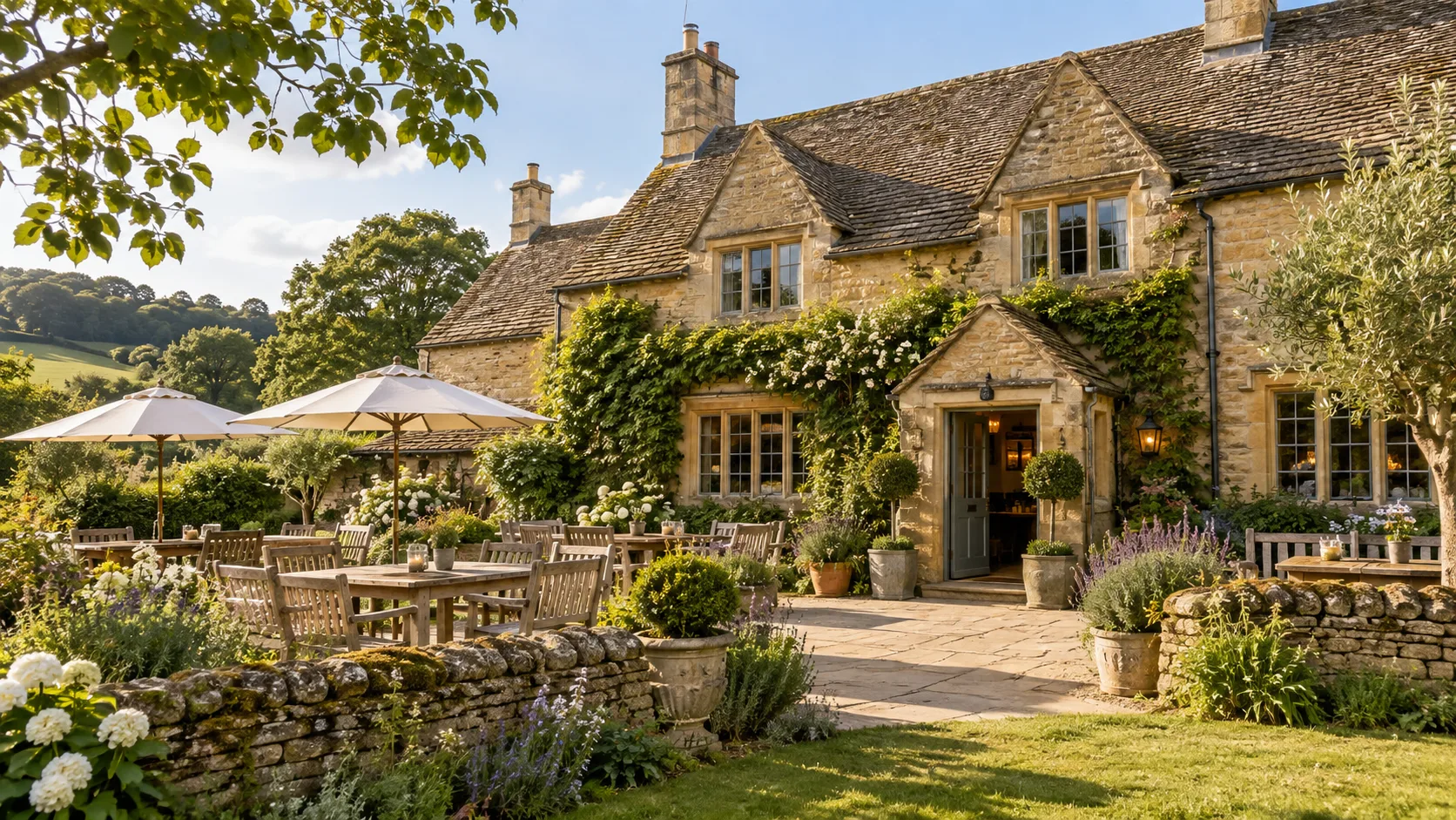 A honey-coloured stone country inn with a sunny garden terrace